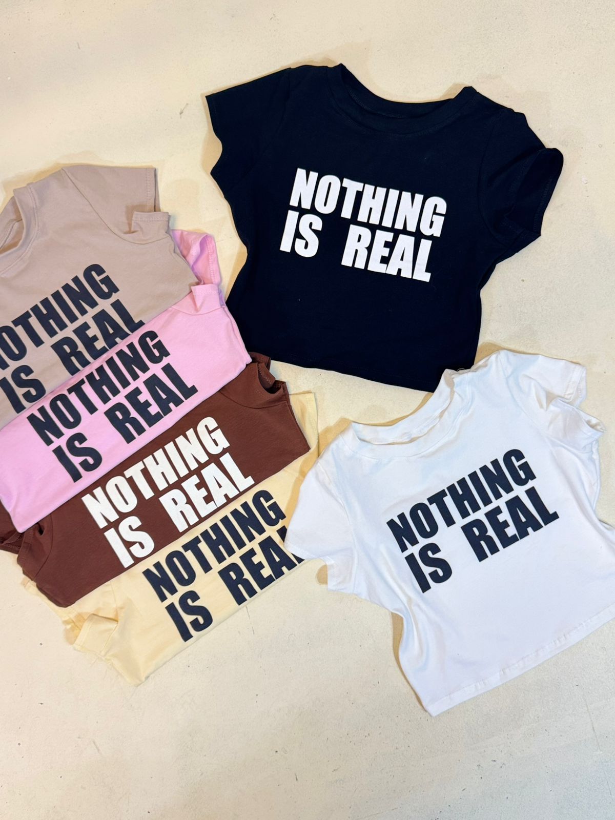 Baby Tee “NOTHING IS REAL” Algodon lycra